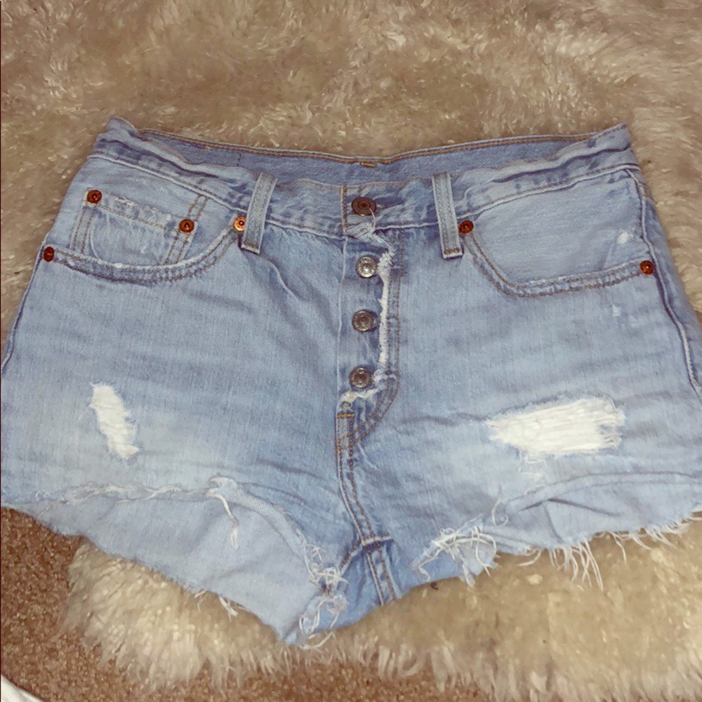 Levi’s 501 distressed denim cutoff. Size 26.